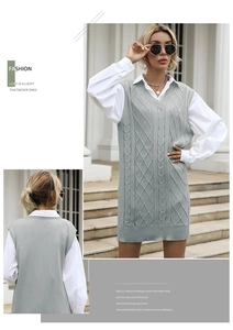 Detailed cable knit pattern on a gray V-neck sweater vest with a relaxed long tunic fit
