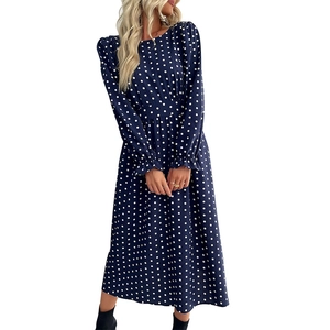 Navy blue polka dot long sleeve midi dress with elegant ruffled cuffs and a round neckline