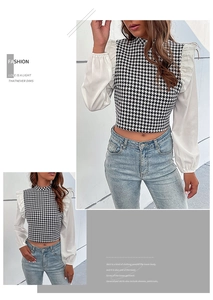 Detail van houndstooth cropped shirt met lantaarnmouwen en ruches bij de schoudernaden