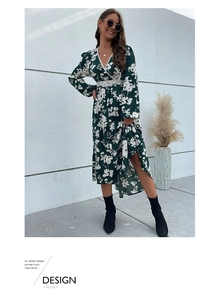 Close-up of V-neck floral dress featuring intricate lace trim and dark green print