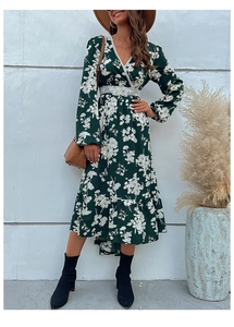 Detail of V-neck lace trim and floral pattern on dark green long sleeve dress