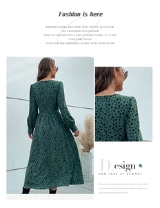 Detail view of V-neck knot design and polka dot pattern on a green dress
