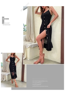 Detail of black strapless midi dress featuring a button-down front and delicate lace hem