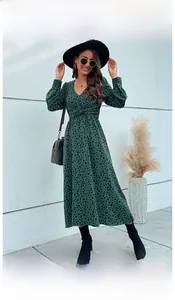 Detail view of V-neck long-sleeve midi dress with dark green leopard print and waist pleats