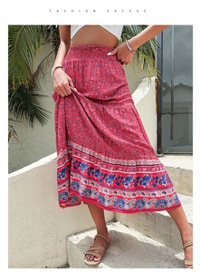 Detail of red bohemian floral skirt with elastic waist and ethnic pattern hemline