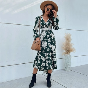 Deep green floral maxi dress with long sleeves, lace trim v-neck and ruffled hemline
