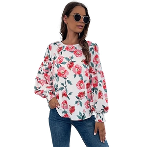 Chemisier femme chic à manches longues avec imprimé floral rose et poignets élastiques