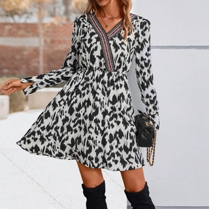 Women's V-neck printed long sleeve dress with black and white abstract pattern and lace trim