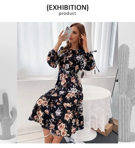 Detailed view of chiffon floral dress with ruffled hem and ribbon bow cuffs