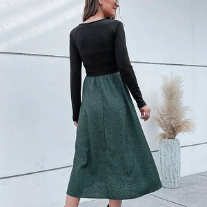 Abito da donna linea A con corpetto nero a costine e gonna verde con stampa leopardata