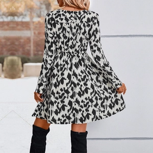 Women's V-neck printed dress with black and white abstract pattern and long sleeves