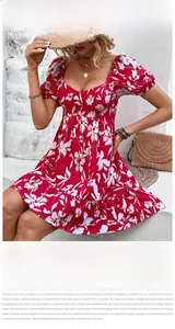 Detail of red floral V-neck dress with puff sleeves and ruffled hem for summer vacation