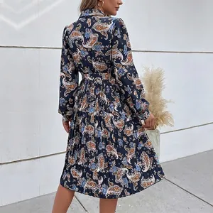Ethnic paisley print long sleeve pleated midi dress in navy blue with a matching belt