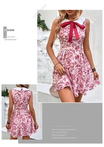 Close-up of the white Peter Pan collar and vibrant red bow on a floral print dress