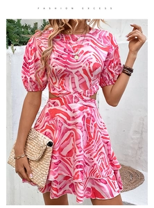 Detailed view of the pink marble print dress with waist cut-outs and ruffled hemline