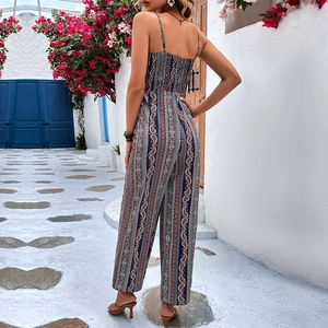 Tuta bohémien con stampa paisley a gamba larga e schiena scoperta in blu navy estivo