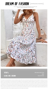 Detail of white V-neck summer dress with colorful butterfly prints and tiered ruffles