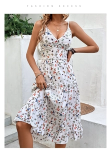 Detailed view of colorful butterfly print and layered ruffles on white V-neck midi dress