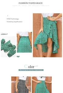 Close-up detail of green floral midi skirt with ruffle hem and irregular wrap design