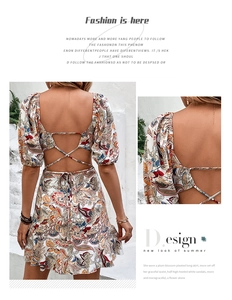 Detail of bohemian floral print dress featuring crisscross backless lace-up design
