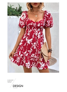 Detail of red floral dress featuring puff sleeves and a ruffled hemline in French style