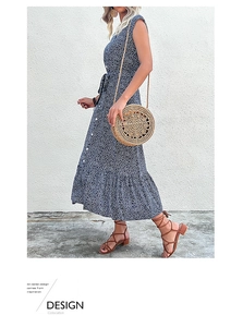 Detailed look at navy floral midi dress featuring a cinched waist and boho ruffles