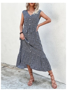 Detail of dark blue floral maxi dress featuring V-neck, front buttons and waist tie