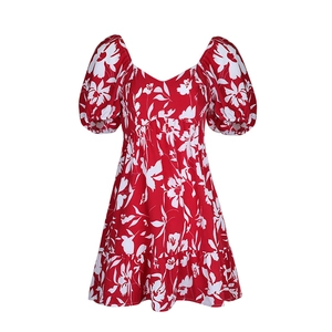 Detail of square neck and floral print on red French tea break summer dress