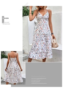 Detail of floral V-neck midi dress featuring butterfly prints and tiered ruffle skirt