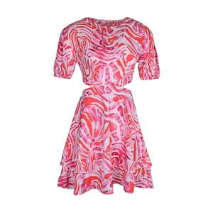 Detail of pink and red water ripple print dress with waist hollow-out and ruffled hemline