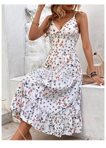 Detail of V-neck ruffled bodice and butterfly print on the white summer sundress