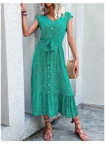 Detail of green floral midi dress featuring V-neckline and white button accents