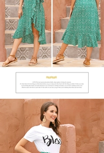 Detailed view of green polka dot wrap skirt with ruffle hem and white graphic t-shirt