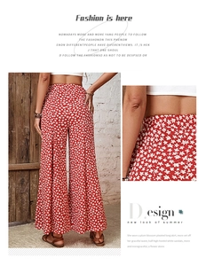 Detail of red floral high-waist wide-leg pants with elastic waist and boho patterns