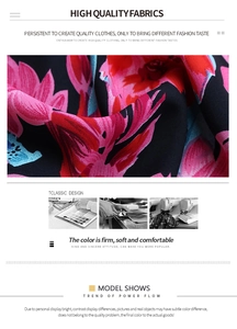 Detailed close-up of floral print fabric design with vibrant pink and blue flowers on black