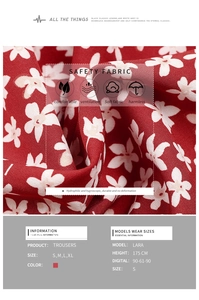 Detail of red floral high-waist wide-leg trousers showing soft breathable fabric texture