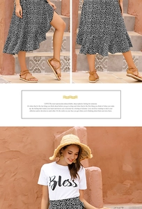 Close-up of black and white polka dot wrap skirt with ruffle hem and summer sandals