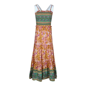Detail of bohemian floral maxi dress featuring tiered skirt and smocked bust design
