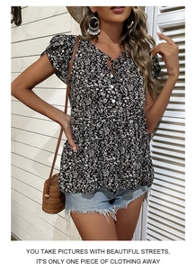 Detail of floral V-neck top with white buttons and tie front for a bohemian summer look