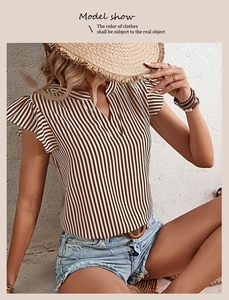 Detail view of V-neck striped blouse with ruffle sleeves and textured fabric detail