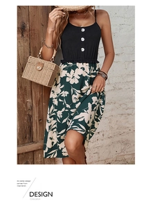 Detail of floral patchwork dress with white buttons and feminine ruffles on the waist