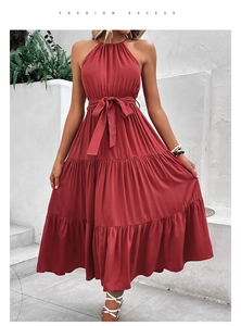 Detailed view of red halter neck dress with layered tier skirt and waist tie