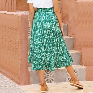Outdoor back view of a green floral wrap midi skirt with ruffle hem for summer fashion