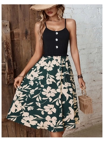 Detail of floral patchwork dress featuring white buttons and a wide summer skirt