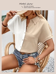 Detail view of women's short-sleeved contrast shirt with lapel collar and button closure