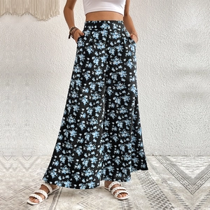 Women high waisted wide leg floral trousers with a flowy drape for summer vacation wear