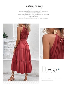 Detail of burgundy tiered halter maxi dress with ruffled texture and backless design