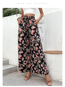 Detail of floral wide-leg pants with elastic drawstring waist and side pockets