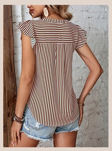 Detail of ruffled flutter sleeves and mixed stripe patterns on a summer sleeveless blouse