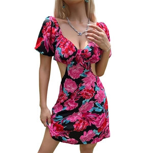 Floral mini dress with cutout waist and deep V-neckline in black and pink